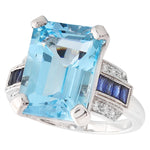 SKY BLUE TOPAZ CENTER WITH DIAMOND AND SAPPHIRE WHITE GOLD RING