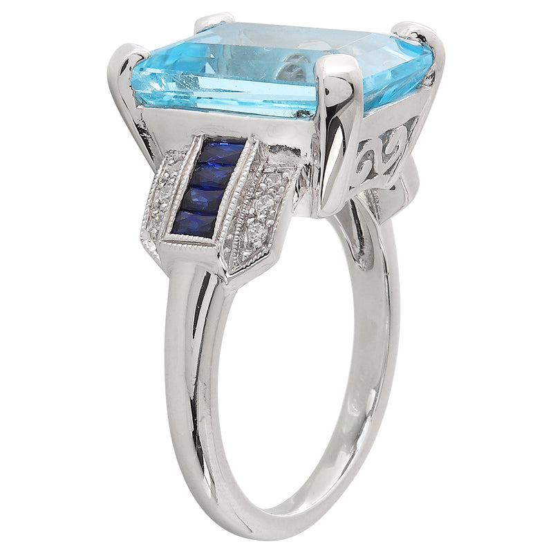 Sky blue topaz center with diamond and sapphire white gold ring