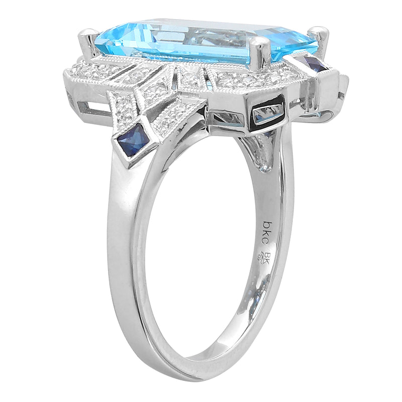 DIAMOND AND SAPPHIRE SET WITH A 14X8 MM SKY BLUE TOPAZ CENTER ON WHITE GOLD RING