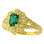 TSAVORITE EMERALD CUT CENTER AND DIAMOND YELLOW GOLD RING