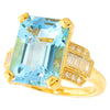 Sky blue topaz 14x10mm emerald cut center with diamond yellow gold ring