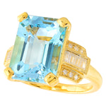 Sky blue topaz 14x10mm emerald cut center with diamond yellow gold ring