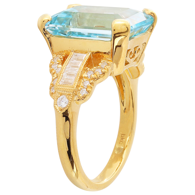 Diamond with Emerald Cut Sky Blue Topaz Center Mount Yellow Gold Ring