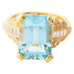 Diamond with Emerald Cut Sky Blue Topaz Center Mount Yellow Gold Ring