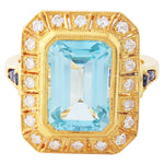 SKY BLUE TOPAZ 12X8.2MM MOUNT CENTER WITH DIAMOND AND SAPPHIRE ON YELLOW GOLD RING