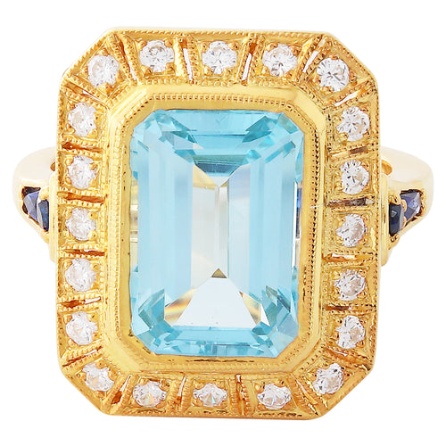 Sky blue topaz 12x8.2mm mount center with diamond and sapphire on yellow gold ring