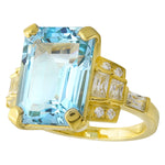 Sky Blue Topaz 14x10mm mount center on yellow gold ring