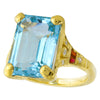 EMERALD CUT MOUNT SET WITH A 14X10MM SKY BLUE TOPAZ CENTER ON YELLOW GOLD RING