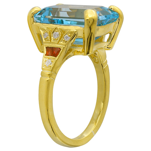 EMERALD CUT MOUNT SET WITH A 14X10MM SKY BLUE TOPAZ CENTER ON YELLOW GOLD RING