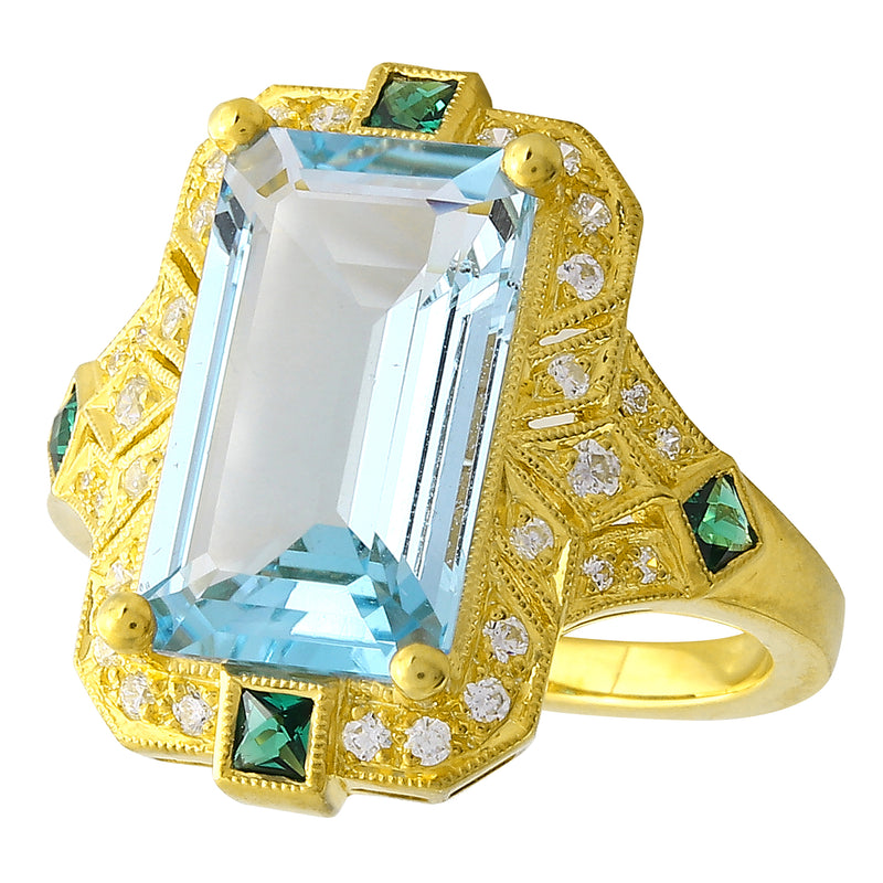 DIAMOND AND TSAVORITE SET WITH A 14X8 MM SKY BLUE TOPAZ CENTER ON YELLOW GOLD RING