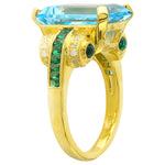 Blue Topaz Center With Tsavorite Side Stone and Diamonds Yellow Gold Ring