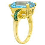 Blue Topaz Center With Tsavorite and Diamond Yellow Gold Ring