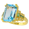 Blue Topaz Center With Tsavorite and Diamond Side on Yellow Gold Ring