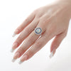 Oval Cut Opal Center, Diamond and Sapphire Halo Ring
