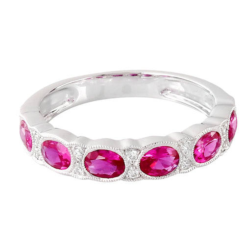 Oval Cut Ruby Set In Halfway Band