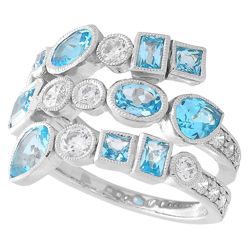 Wide Bezel Set White Sapphire and Swiss Blue Topaz Band